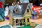 Cardboard toy house for children on white background. Eco-friendly Box for pet or carton playhouse . A small house made of paper