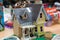 Cardboard toy house for children on white background. Eco-friendly Box for pet or carton playhouse . A small house made of paper