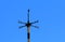 Cardinal direction points blue sky
