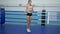 Cardio training, young woman athlete doing skipping exercises using jump rope during workout