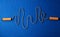 Cardiogram from jumping rope on blue yoga mat background