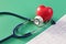 Cardiogram medical stethoscope heart on green background