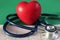 Cardiogram medical stethoscope heart on green background