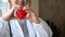 Cardiologist holding red heart shape in hand. Healthcare and medical.