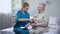 Cardiologist measuring old female patient blood pressure, professional medicare