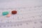 Cardiovascular disease concept. Selective focus. Colored pills on electrocardiograms with ventricular tachycardia. Life-