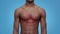 Cardiovascular system problem. Close up shot of unrecognizable black man torso with red pulsating spot on chest
