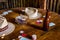 Cards, Poker Chips, Beer Bottle and Cowboy Hats on a Wooden Table