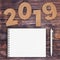 Cardstock Numbers 2019 Happy New Year Sign near White Spiral Pap