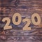 Cardstock Numbers 2020 Happy New Year Sign over table. 3d Rendering