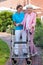 Care assistant helping an elderly lady