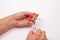 Care for cuticles. Hand holding scissors for manicure o