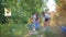 Care nature ecology, young family of activist with kid girl collects garbage in trash bag while cleaning nature from