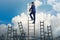 The career concept with businessman climbing ladder