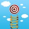 Career ladder made of yellow pencils with target with blue sky background