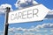 Career - signpost with white arrow, sky