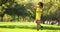 Carefree African woman walking on the grass