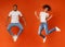 Carefree black millennial man and woman jumping in air