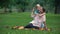 Carefree boy hugging mother in park, social program for single parent family