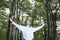 Carefree Businessman Standing Alone In Forest