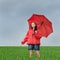 Carefree girl enjoying rain shower outdoors