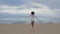 Carefree girl running beach rear view. Happy sexy woman enjoying peaceful sand