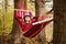 Carefree happy woman lying on hammock enjoying harmony with nature. Freedom. Enjoyment. Relaxing in forest.