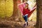 Carefree happy woman lying on hammock enjoying harmony with nature. Freedom. Enjoyment. Relaxing in forest.