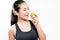 Carefree healthy hispanic woman with apple and water smiling wit