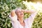 Carefree older woman with hands in hair