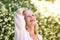 Carefree older woman outside with hand in hair