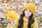 Carefree and relaxed. Autumn skin care routine. Kid wear warm knitted hat. Girl relaxing autumn nature background