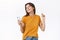 Carefree tender modern stylish woman in yellow t-shirt enjoying awesome beat in new wireless earphones, dancing with