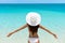 Carefree Woman On Beach In White Hat And Bikini