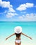 Carefree Woman In White Hat And Bikini On Beach