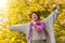 Carefree young african american woman with arms outstretched