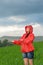 Carefree young girl enjoying rainy weather