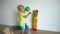 Careful boy child building tower from colorful blocks at home. Gimbal motion