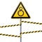 Carefully tightening between rotating elements is possible. Safety sign. The triangular sign on pole with warning bands