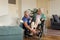 Caregiver doing regular check-up of senior woman in her home.