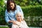 Caregiver help Asian elderly woman disability patient sitting on wheelchair in park, medical concept