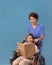 Caregiver takecare elderly woman on wheelchair at nursing home.