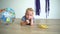 Careless toddler boy lying on floor and eating yellow banana. Gimbal motion