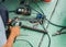 Careless worker use hand grinding without safety gloves, outlet generating electricity sparks