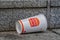 Carelessly discarded one-way drinking cup from a fast food chain on a staircase