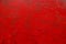 carelessly painted red flat surface - texture and full frame background