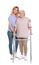Caretaker helping elderly woman with walking frame on white