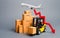 Cargo airplane, forklift truck with cardboard boxes and a red arrow down. Drop in industrial production and business. Decrease