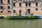 Cargo boat for trade in the canals of the city of Venice.