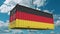 Cargo container with flag of Germany. German import or export related conceptual 3D animation